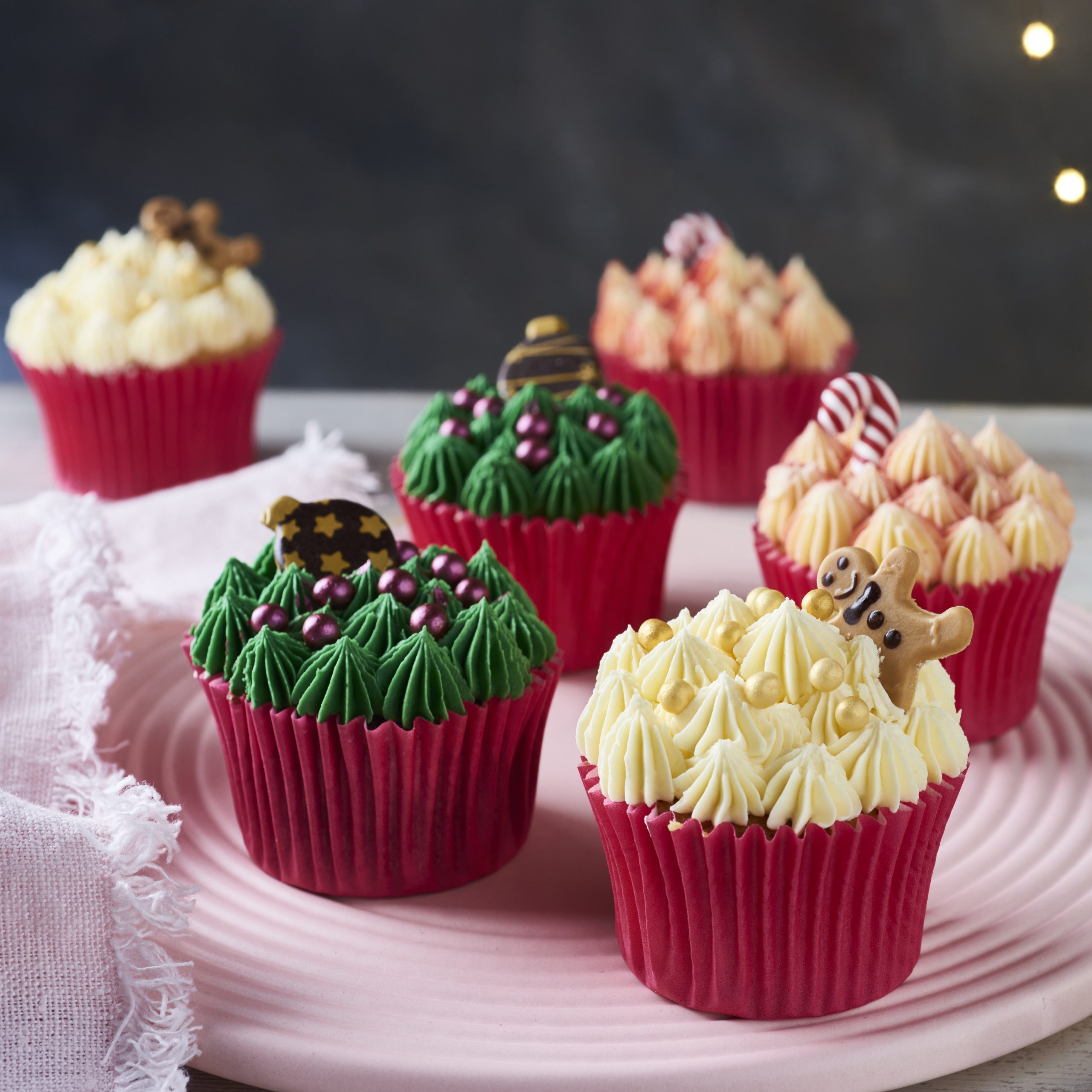 Christmas cupcakes, green, yellow and red with chocolate decorations